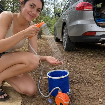 Sarah using AquaTrail beside a parked car